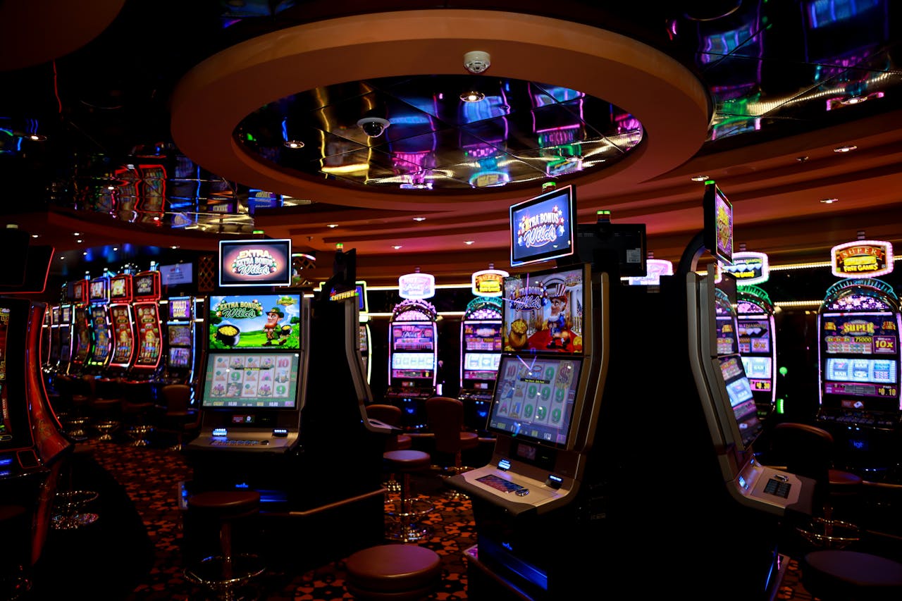 bachelor-party-03 Vibrant casino floor with colorful slot machines and bright lights capturing a lively gaming atmosphere.