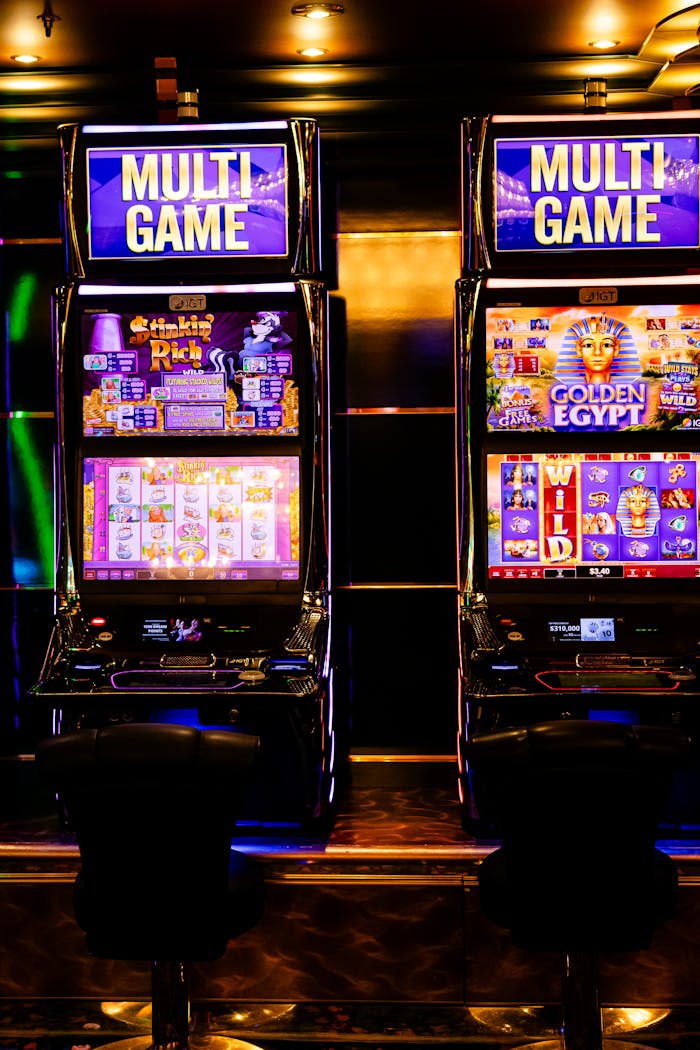 private-party-02 Colorful multi-game slot machines inside a lively casino environment at night.